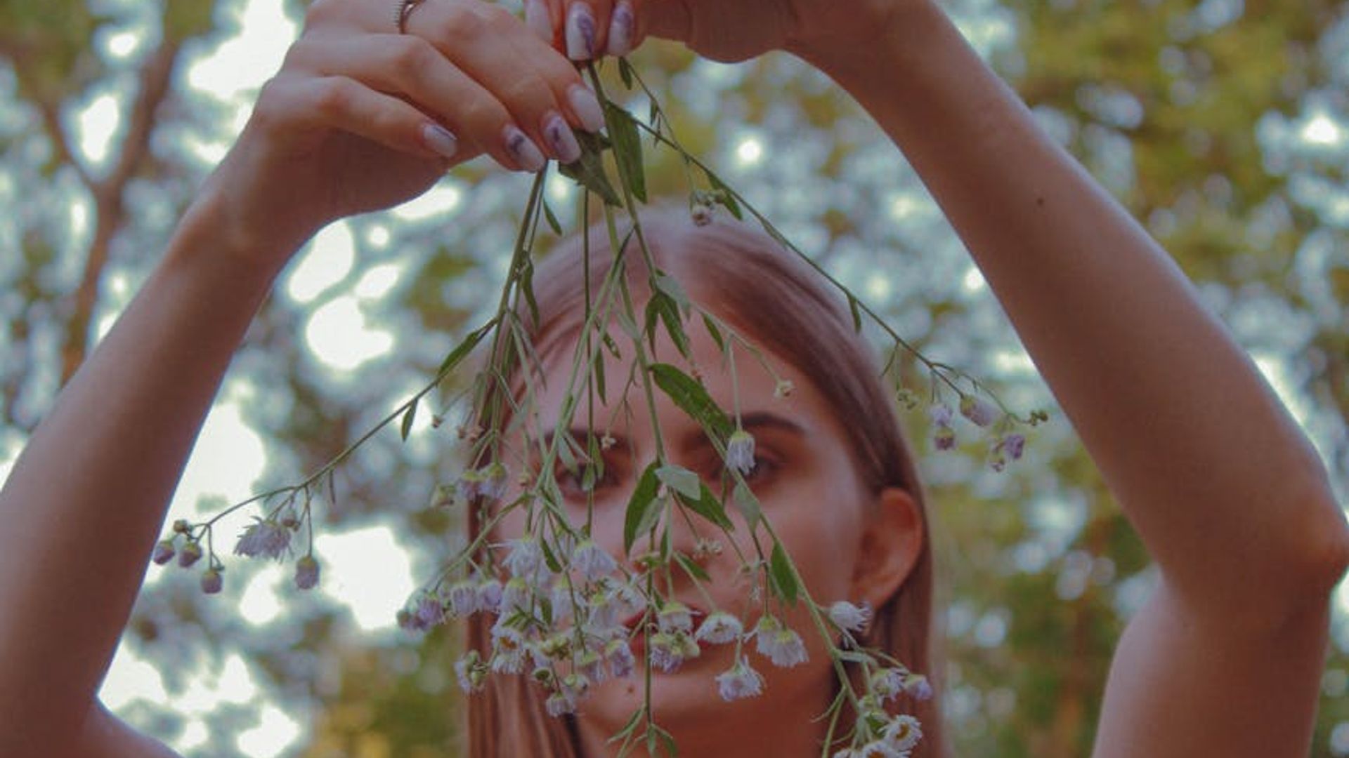 Silhouette of a man in a focused athletic pose in a dark, minimalist environment.